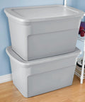 Two stacked Six Pack Heavy Duty 30 Gallon Plastic Storage Containers With Secure Lids Hella Roomy Gray Bins in a home setting.