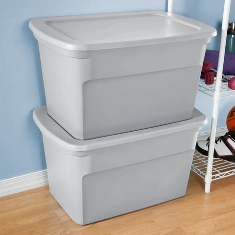 Two stacked Six Pack Heavy Duty 30 Gallon Plastic Storage Containers With Secure Lids Hella Roomy Gray Bins in a home setting.