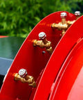 Close-up of valves on Remote Controlled Crawler Spray Machine For Precision Agricultural Field Applications With Durable Tracked Equipment Design.