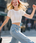 Woman walking, wearing jeans with Two Pack Star Carabiner Keychains Dope Y2K Aesthetic Clip For Keys Purses Backpacks Silver Chrome.