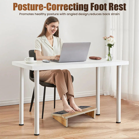 Woman using ergonomic under desk foot rest with non slip surface for better posture and circulation, four inch high stool underneath table
