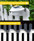 Solar Powered Gutter Lights 6 Pack With 9 LEDs Outdoor Fence Lights installed on white picket fence, day and night view