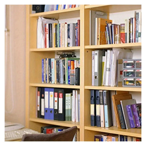 Books on wooden shelves in a home office, illustrating use of Cam Lock Pins Set For Do It Yourself Furniture And Cabinet Builds.