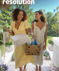 Women at the door smiling, holding gifts, showcasing Wireless Video Doorbell Packing 2K Resolution And Long Battery Life With Snappy Audio Clarity Head To Toe Frame Smart Motion Alerts Installs Like A Breeze Includes Sync Module Core Matte Black.