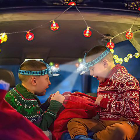 Children wearing Dino Themed LED Headlamp For Kids And Adults With Four Modes Hands Free Dino Headlamp For Night Hiking Camping Gear Essentials