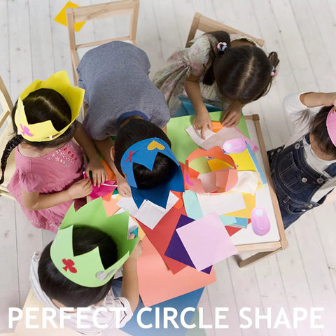 Children using Totally Worth It 3 Inch Circle Craft Punch Pink for DIY projects at a colorful table, featuring paper crafts.