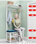 Woman sitting on Four In One Entryway Coat Rack With Bench And Shoe Organizer, Two Tier Hallway Shoe Shelf For Boots And Shoes