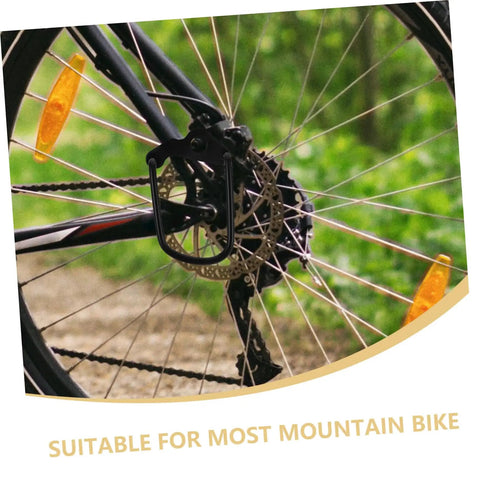 Rear Derailleur Guard And Rack Protector For Mountain Road And Folding Bikes In Black, mounted on a bike wheel, outdoors