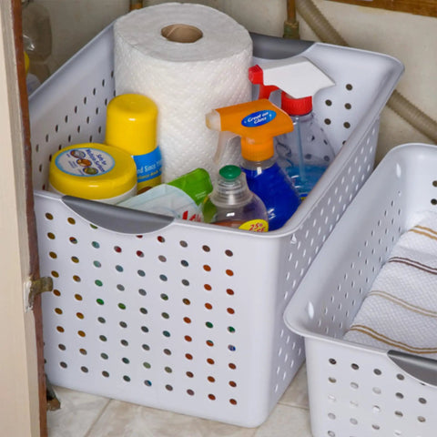 Deep Ultra Open Top Plastic Storage Baskets Six Pack White holding cleaning supplies under a sink.