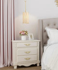 Gold Pendant Lighting With White Glass Cylinder for Bedroom, modern glam fixture with elegant design above bedside table