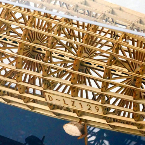 Detailed view of 1:453 Scale D LZ129 Airship Wooden DIY Model Kit showcasing laser-cut wooden parts and intricate design.