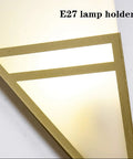 Modern Black Acrylic Wall Sconce Minimalist Bedroom Bedside Lamp With Uniform Soft Glow For Living Room Decor showing E27 lamp holder close-up.