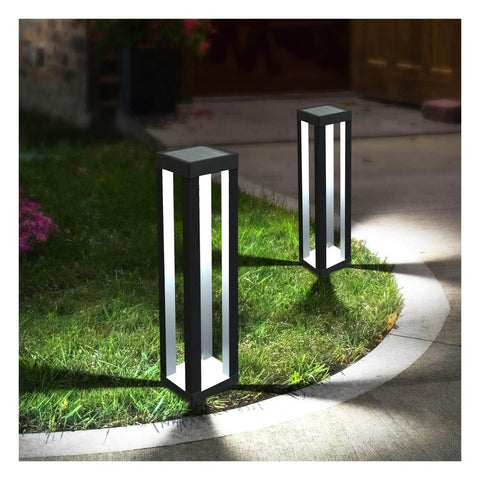 Outdoor Solar Floor Lanterns Set Of 2, Stainless Steel Black Lantern Lights illuminating a garden pathway at night