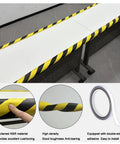 Heavy Duty U Channel Edge Corner Guard 197 Inch Yellow Black Self Adhesive NBR Foam Safety Tape on a table edge for protection.