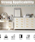 Room with white dresser and vanity featuring vintage bow shaped dresser knobs for desk wardrobe TV cabinet and bookcase.