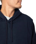 Hella Comfy Mens Flame Resistant Hoodie Sweatshirt With Heavyweight 12 5 Oz Fleece Pullover For Tough Industrial Job Site Work Wear Navy Cotton Acrylic Blend Meets Nfpa Atptv Hrc Safety Specs Xl Regular close up of hood and neckline