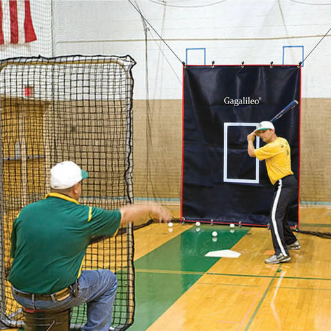 Man practicing batting with 6x8Ft Batting Cage Backstop With Heavy Duty Padding And Strike Zone Vinyl Net Protector