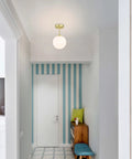 Semi Flush Mount Ceiling Light With Globe White Shade In Satin Brass Finish 1 Light Modern Fixture For Living Room And Dining Room With Chic Contemporary Vibe Close To Ceiling Design in hallway.