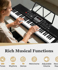 Person playing 61 Key Portable Keyboard Piano With Light Up Keys Microphone Headphones Stickers Carrying Bag 200 Rhythms 200 Tones 70 Demos