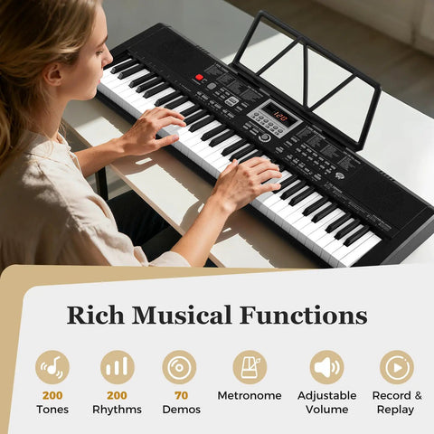 Person playing 61 Key Portable Keyboard Piano With Light Up Keys Microphone Headphones Stickers Carrying Bag 200 Rhythms 200 Tones 70 Demos