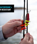 Person holding fishing rods secured with Gear Tie 3 Inch Reusable Rubber Twist Tie for Cord and Cable Organization Flexible Bendable Wire with Strong Rubber Grip Ideal for Home DIY and Electric Cords 24 Pack Black