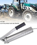 High Pressure Grease Gun 8000 PSI 400cc Manual Oiling Greaser with tractor background