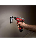 Using 12 Volt Cordless Hex Screwdriver Kit With Two 1.5Ah Batteries on wall socket with variable speed trigger