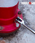 18 Inch Breaker Bar With Dual Half Inch And Three Eighths Drives loosening rusted bolts on red pipe fitting