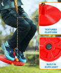 Child sitting on red textured platform of climbing rope tree swing with platforms and seat for kids kid-friendly outdoor playground accessories