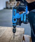 User using Beast Of A Cordless Rotary Hammer Drill With Brushless Motor SDS Plus 20V Battery And Fast Charger on wood