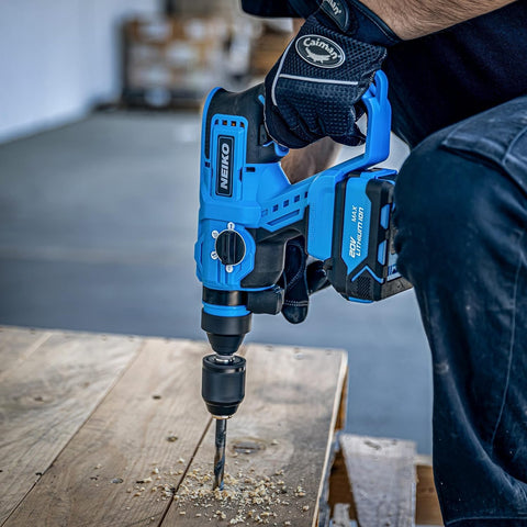 User using Beast Of A Cordless Rotary Hammer Drill With Brushless Motor SDS Plus 20V Battery And Fast Charger on wood