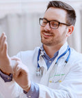Latex-free vinyl gloves, clear, size large, 100-count; medical professional preparing to glove up.