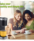 Women enjoying coffee made with Unbleached K Cup Disposable Paper Filters With Lid For Reusable K Cup Pods by a single serve coffee maker