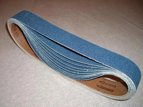 Tough As Nails 1 1/2 X 30 Inch Zirconia Sanding Belt 180 Grit 15 Pack rolled, showing flexible backing for woodworking and metal finishing.