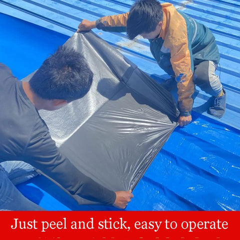 Two workers applying Rock Solid Self Adhesive Waterproof Membrane Roll on a blue roof, demonstrating easy peel and stick application.