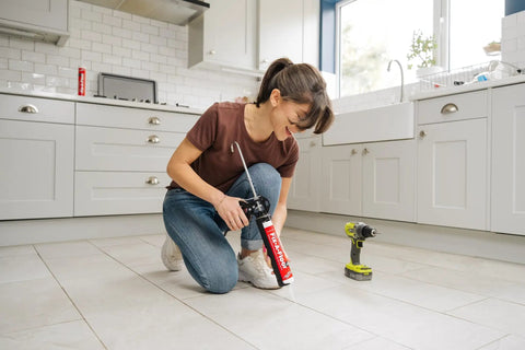 Woman using DIY Friendly Floor Repair Adhesive For Loose Tiles And Creaky Floors in a kitchen setting