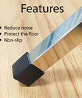 Close-up of a 20 Piece Square Rubber Chair Leg Cap Black on a chrome chair leg, designed as heavy duty floor protectors.