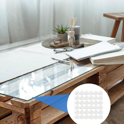 Heavy Duty Adhesive Non Slip Bumper Dots For Glass Tables And Cabinets Provide Dang Good Grip While Keeping Furniture Straight Up Safe From Daily Scratches And Slipping Hazards on a glass table with decor.