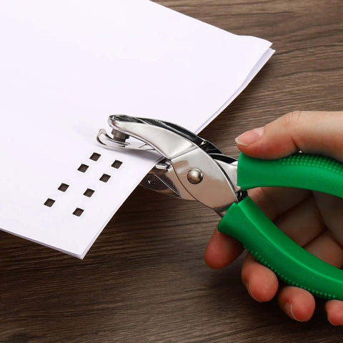 Hand uses Green Square Hole Punch 0.2 Inch Handy Handheld Paper Puncher With Ergonomic Grip to punch square holes in paper