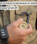 Person attaching Beefy Heavy Duty Retractable Keychain With Multitool Carabiner Badge Holder to jacket.