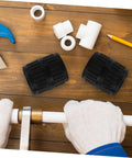 2 Pack Deburring Tool Inner And Outer Reamers For Water Pipes on a wooden table with pipe fittings and a plumber's hands working on a pipe