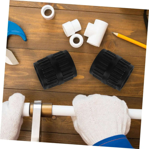 2 Pack Deburring Tool Inner And Outer Reamers For Water Pipes on a wooden table with pipe fittings and a plumber's hands working on a pipe
