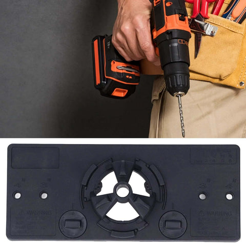 Hinge jig base plate and cordless drill, 2 items; black 35mm hinge hole saw guide shown with an orange/black drill.