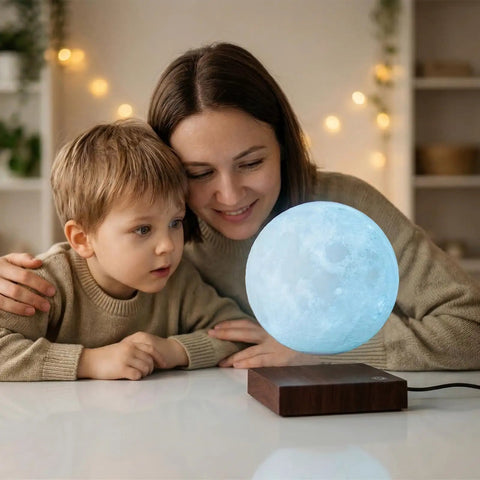 Lit Floating Moon Lamp With Magnetic Levitation on desk with mother and child