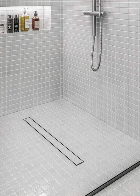 Heavy Duty 36 Inch Linear Shower Drain With Satin Stainless Steel Surface Mount Or Tile In Grate featuring Sure Lock Odor Seal in shower area.