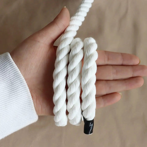 Hand holding white cotton rope three eighths inch thick twisted craft rope, 100 feet eco friendly natural cord, soft yet sturdy