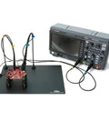 2X SQ200 200 MHz Handsfree Oscilloscope Probes For Precision Measurements with PCB holders and oscilloscope on black mat