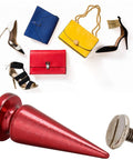 Badass Screw On Metal Spikes and heavy duty leather hardware with stylish bags and shoes in background.