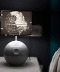 Death Star 3D Touch Lamp USB LED Desk Light With Printed Death Star Shade on bedside table, 14 inch tall, touch activated night light.