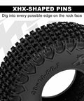 Close-up of XHX 0.7 Inch Pin Tires 40x14mm for 1 To 30 Scale Axial SCX30 RC Car, showing tread pattern and XHX-shaped pins.